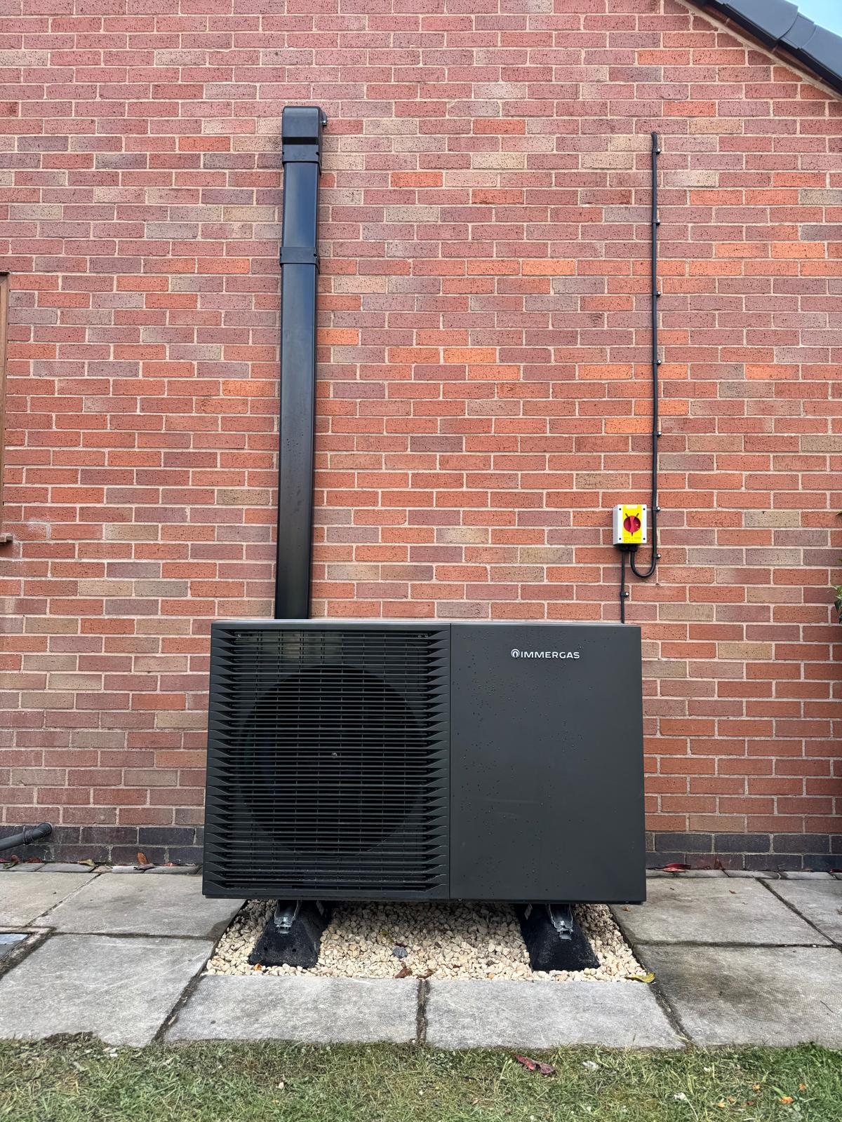 Completed Immergas heat pump installation with neat pipework