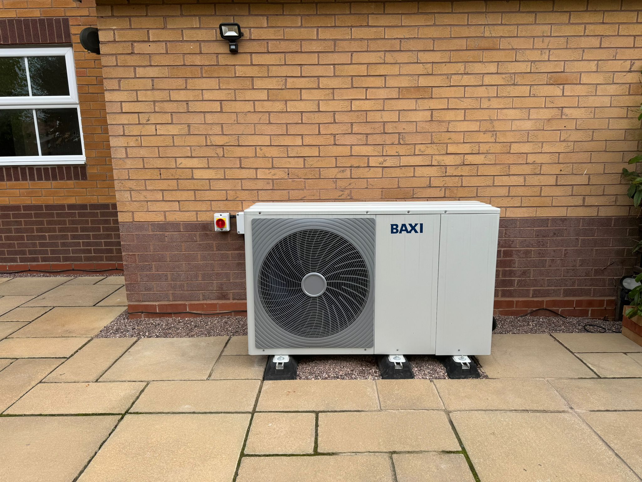 Neatly finished outdoor heat pump installation